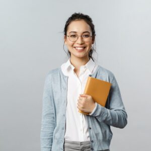 Education, teachers, university and schools concept. Young smiling woman, employer or student in