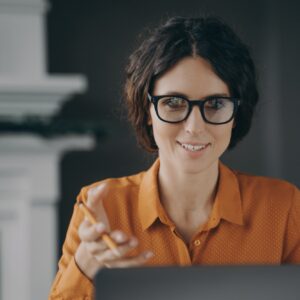 Italian young businesswoman in glasses teacher tutor talking with students during video conference
