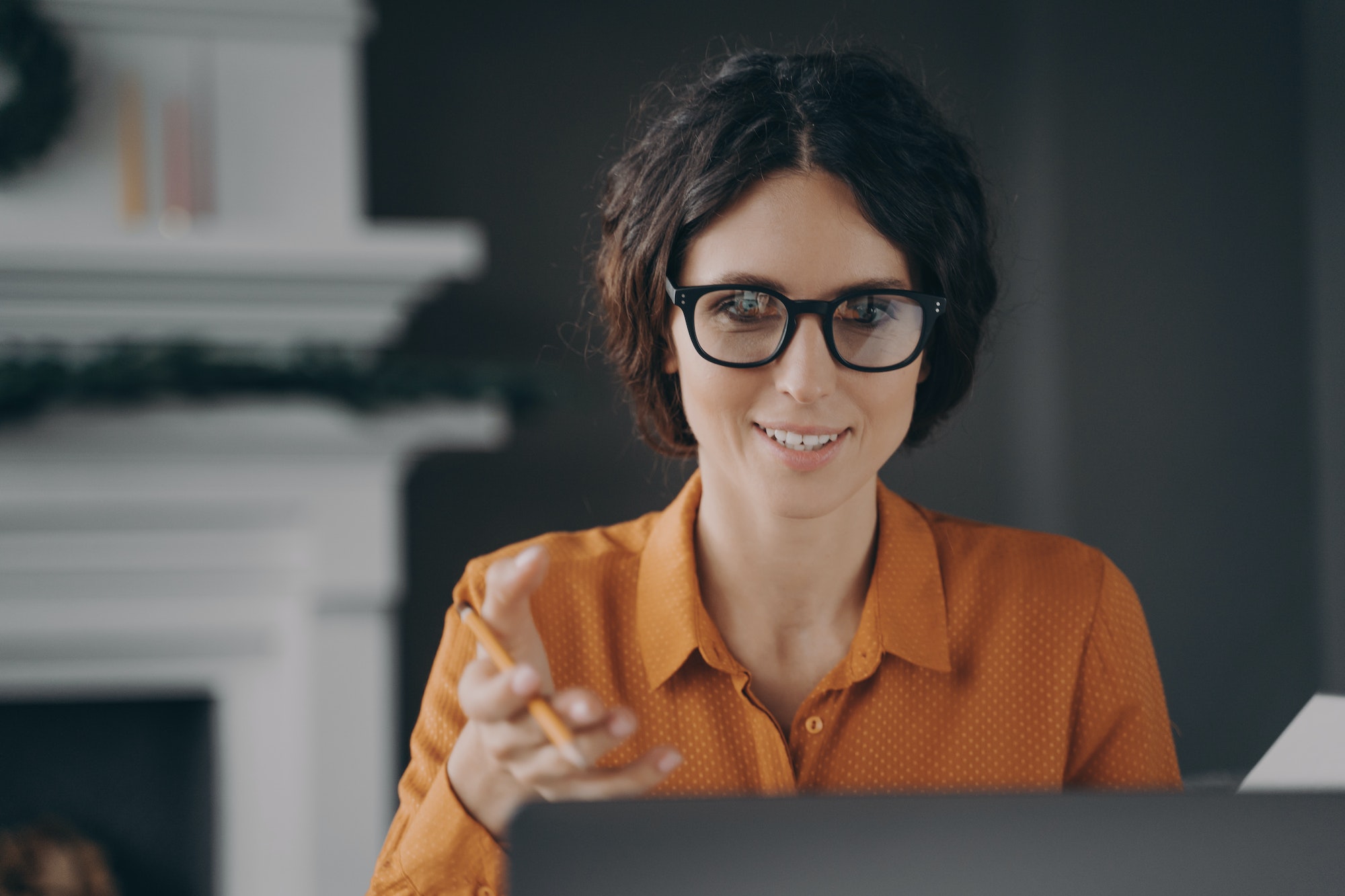 Italian young businesswoman in glasses teacher tutor talking with students during video conference Italian young businesswoman in glasses teacher tutor talking with students during video conference