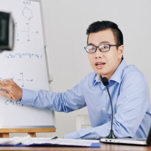 Teacher recording chemistry lesson