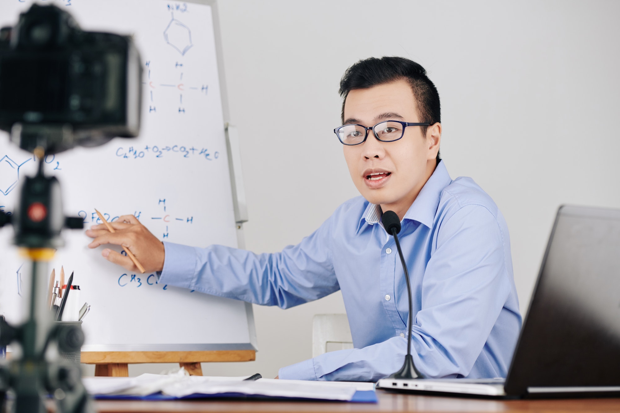 Teacher recording chemistry lesson Teacher recording chemistry lesson