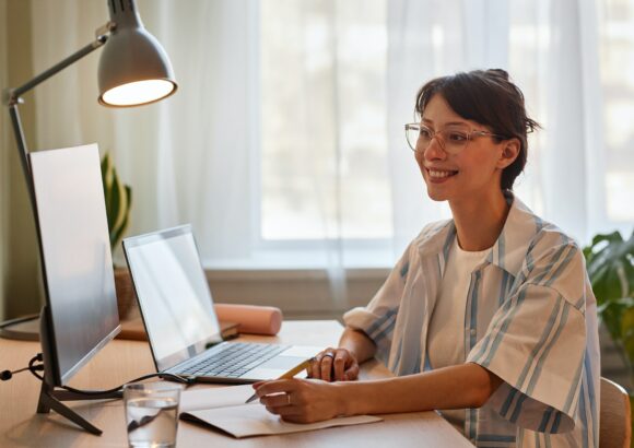 Woman enjoying online education class Woman enjoying online education class